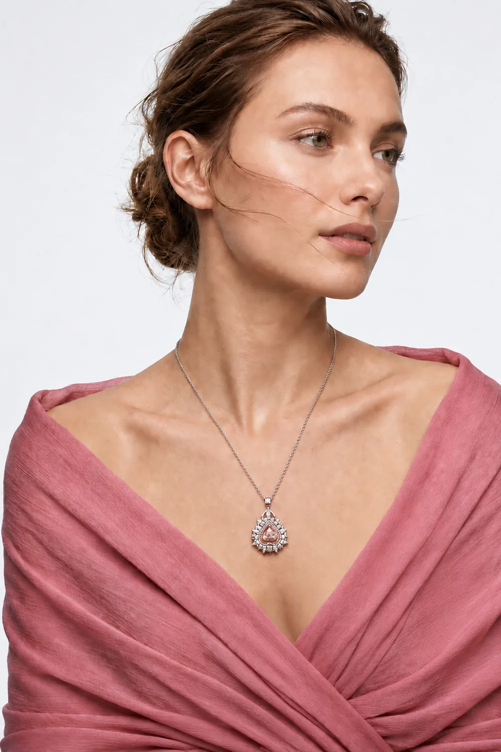 Pink pear pendant worn